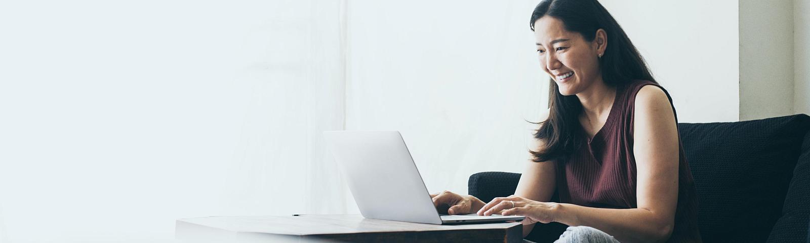 woman on computer in home office setting