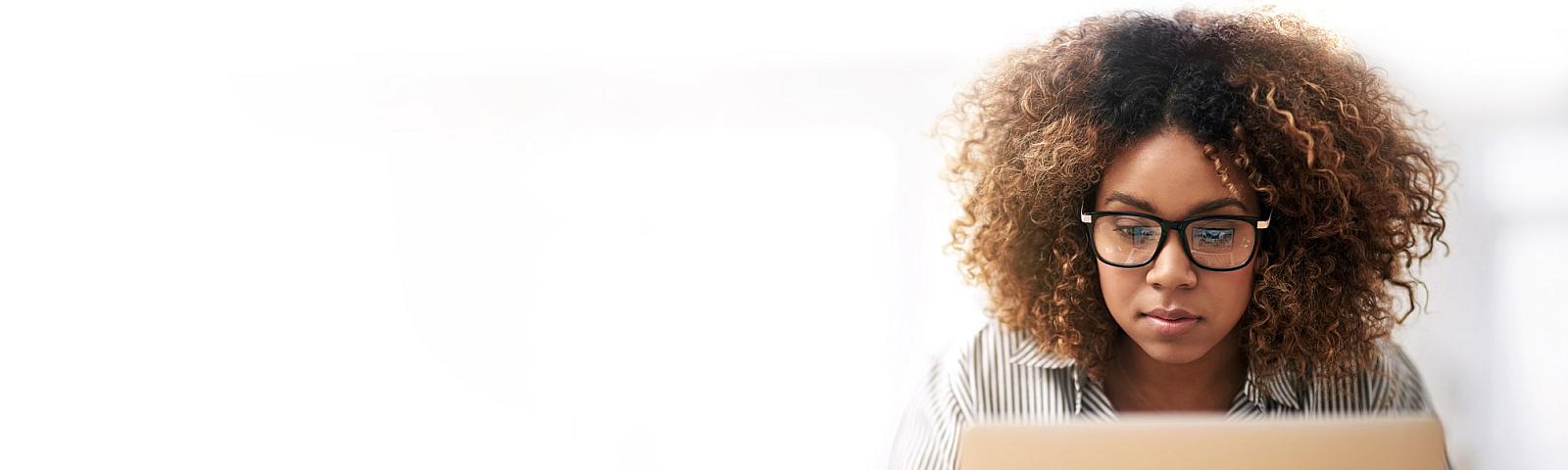 young woman search for information on a laptop 