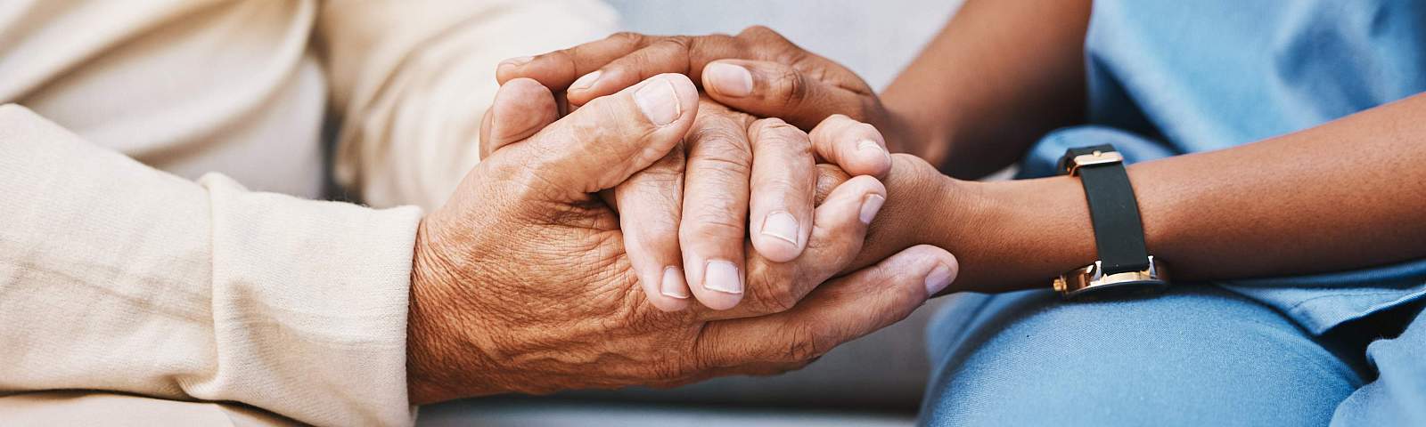 Patient and Provider holding hands 